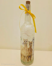 Load image into Gallery viewer, Decorative bottle with a yellow ribbon and image of three Alpacas on a plain background