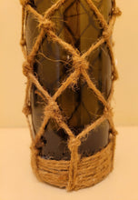 Load image into Gallery viewer, Braided Green Glass Bottle Lamp - Braided Green Glass Bottle Lamp - Green glass standard wine bottle with jute twine braiding in a diamond pattern. Jute twine around the bottom of the bottle. Cork LED lights