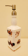 Load image into Gallery viewer, Jack daniels shaped bottle, painted white with chickens detailing around the sides, eggs around the edge at the bottom. Silver pump head
