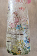 Load image into Gallery viewer, Decoupage Fairy bottle lamp - flower fairy sitting on a mushroom image, on the side of a wine bottle