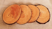 Load image into Gallery viewer, four plain wood slice coasters with bark left on