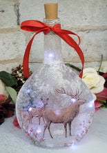 Load image into Gallery viewer, Decoupage Stag Light Up Bottle - Lit up Round glass bottle with Stag detailing. Red bow tied around the neck of the bottle, cork LED lights