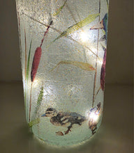 Load image into Gallery viewer, duckling decoupaged onto the bottom of a lit up wine bottle