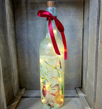 Load image into Gallery viewer, Wine bottle with ducks and ducklings on. Lit up with brown cork. Red ribbon embellishment