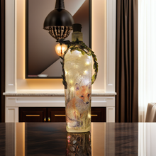 Load image into Gallery viewer, Decoupage Fox Bottle Lamp - Lit up square gin bottle with fox detail and jute twine with leaves wrapped around the neck of the bottle. Cork LED lights

