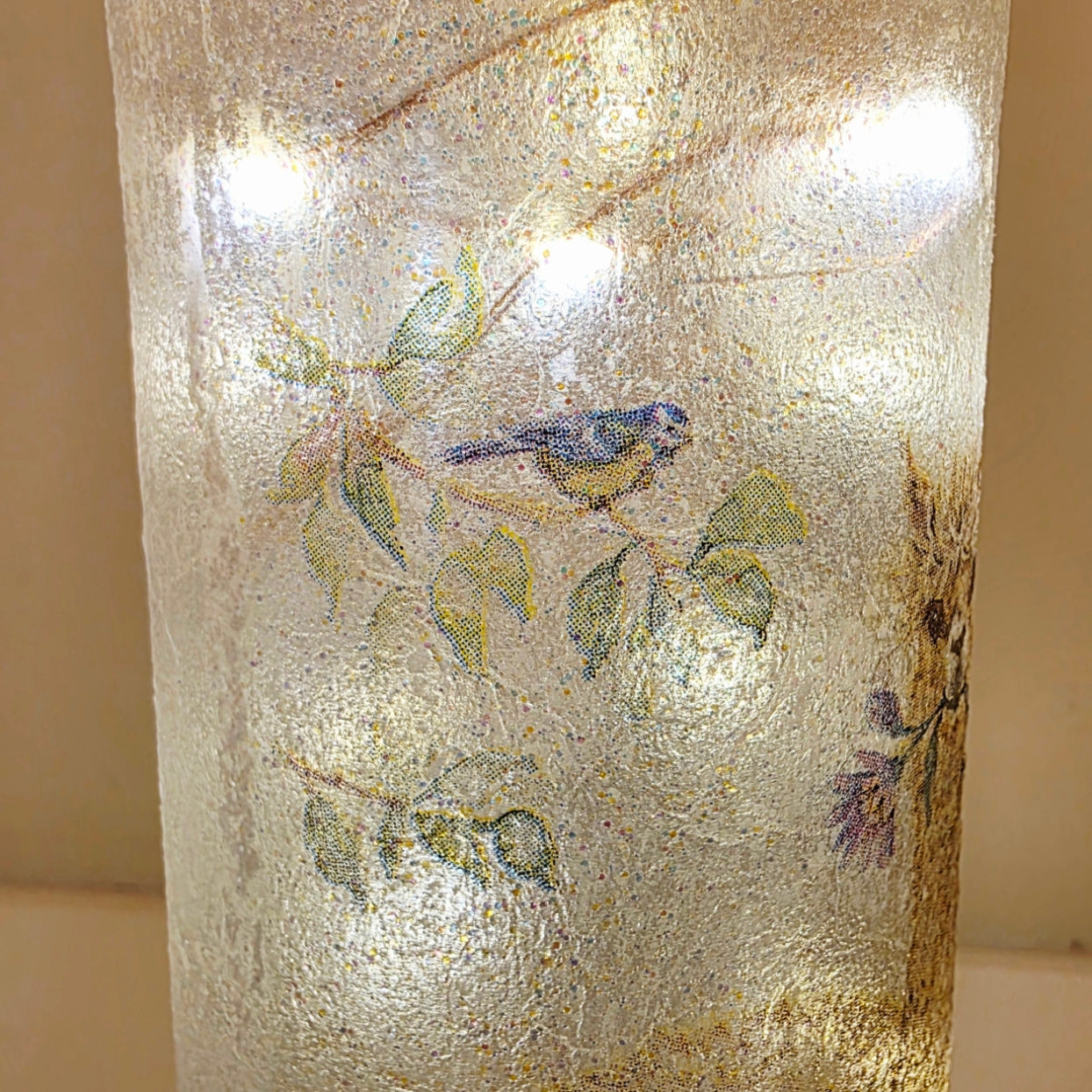Frosted lit up glass bottle with bird and floral design