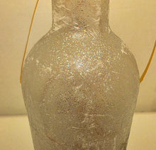 Load image into Gallery viewer, Decorative bottle with textured surface on a neutral background
