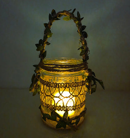 Decorative lantern with leaf-like handle and design on a plain background. Lit up with flameless candle