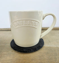 Load image into Gallery viewer, White Baileys mug on a black coaster with a light background
