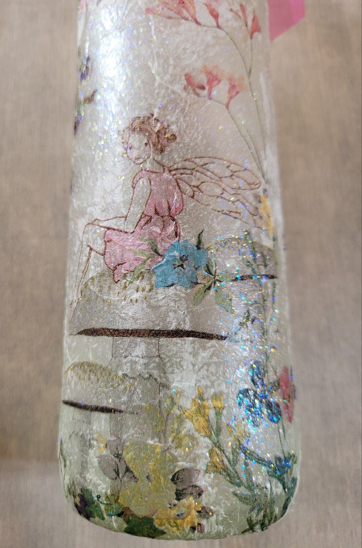 Decoupage Fairy bottle lamp - flower fairy sitting on a mushroom image, on the side of a wine bottle