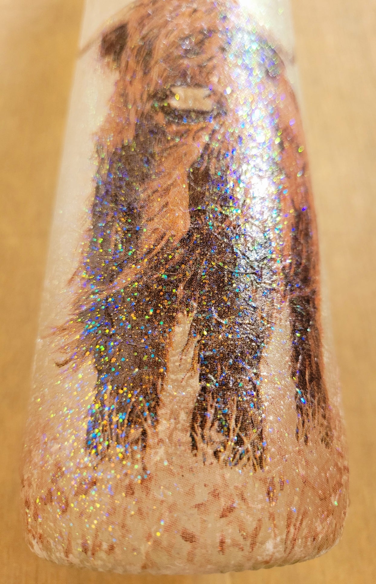 Highland cow detailing on a standard wine bottle