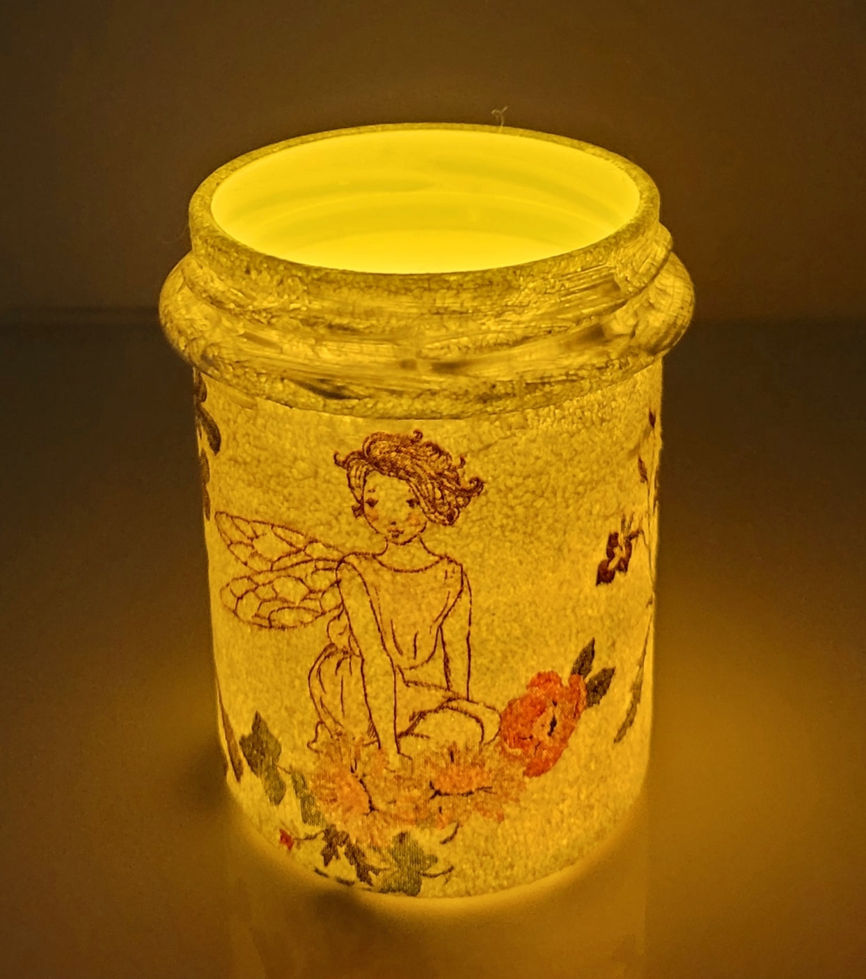 white painted jar with fairy detail, lit up