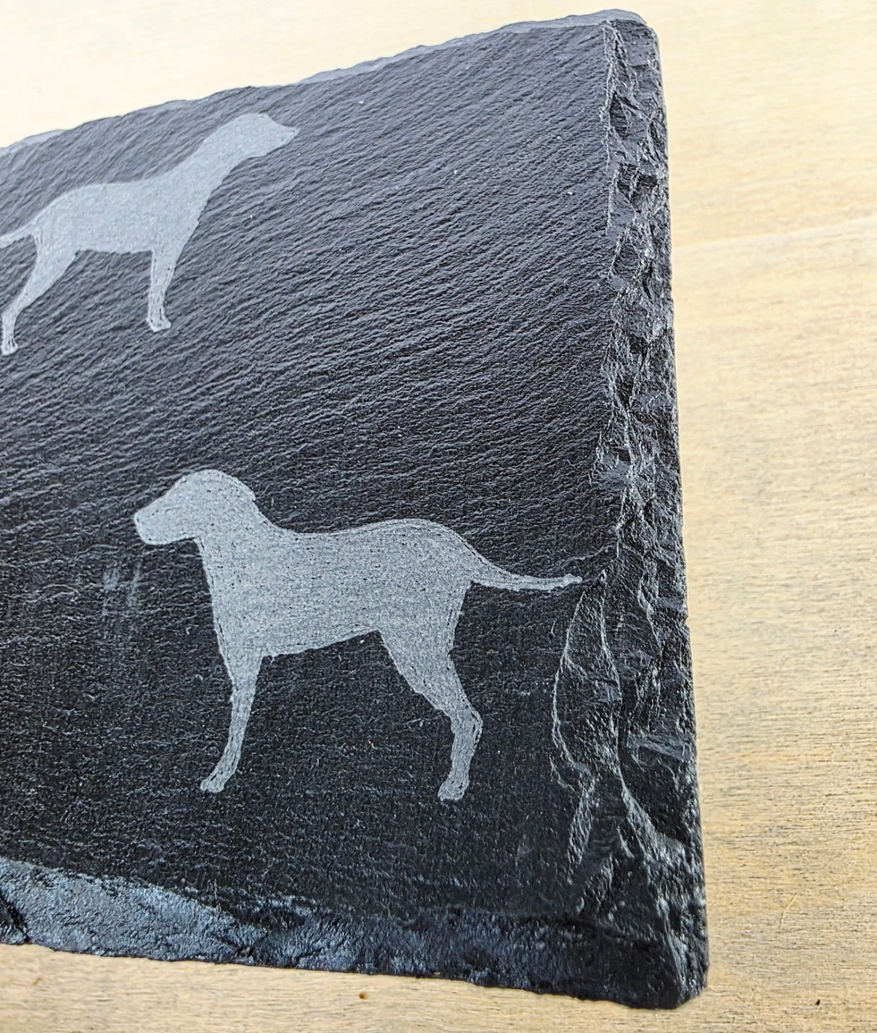 black slate coasters with two labrador etched images on - dogs facing eachother