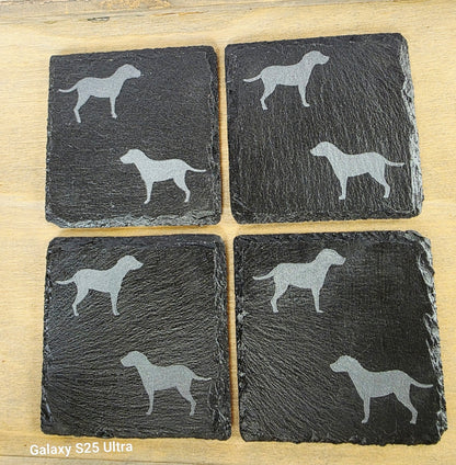 Four black slate coasters each with two labrador etched images on - dogs facing eachother