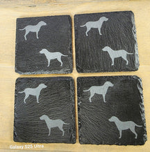 Load image into Gallery viewer, Four black slate coasters each with two labrador etched images on - dogs facing eachother

