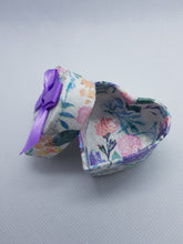 Load image into Gallery viewer, Heart-shaped jewelry box with floral design and purple ribbon on a light gray background
