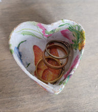 Load image into Gallery viewer, Heart-shaped decorative box with floral patterns containing three rings on a wooden surface
