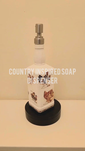 Square white painted bottle with chicken print detail. Silver pump head in the top