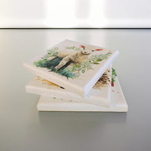 Load image into Gallery viewer, Three square canvas art pieces stacked. Each canvas features a different decoupage wildlife illustration. The top canvas shows a lamb surrounded by greenery. The other canvases have nature-themed illustrations.
