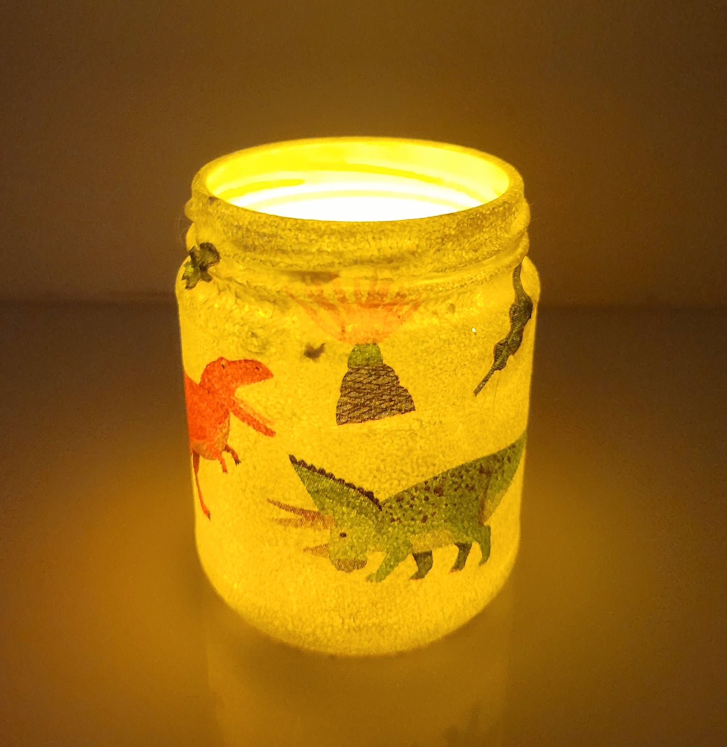white painted jar with Dinosaur detail, lit up