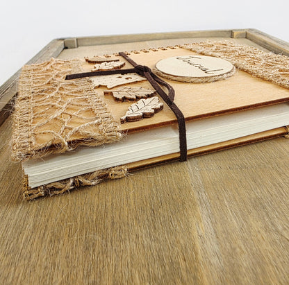 Wooden journal with decorative woodland elements. Faux suede tie. 