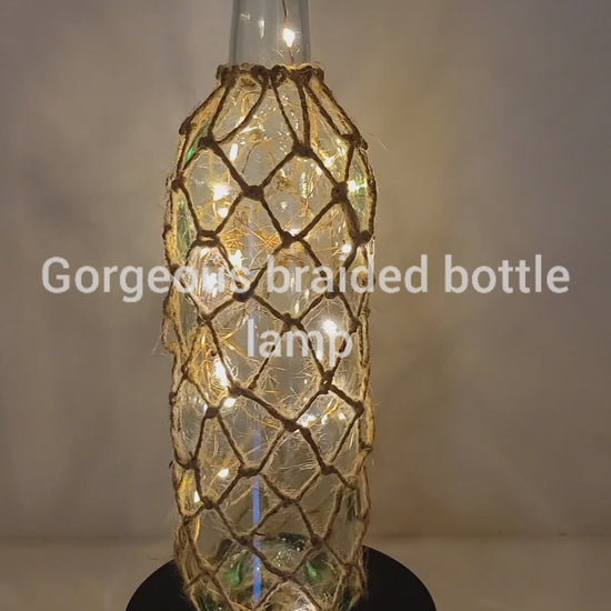 Rotating Lit up Wine bottle with braided jute string detail