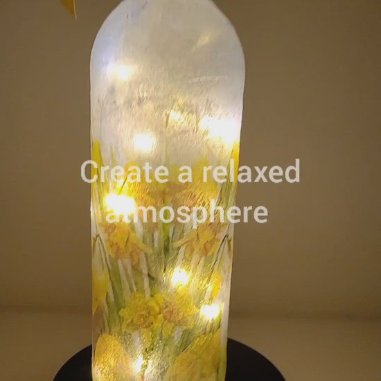Rotating example of a Lit up wine bottle with Rabbit detail, cork lights and yellow bow